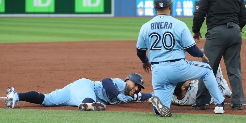 Steve Russell - Toronto Star
The Jays’ George Springer slides into third base after a shallow ball to right field got by a diving Steven Souza Jr.
