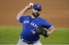 AP Photo/Tony Gutierrez
Toronto Blue Jays starting pitcher Tanner Roark throws to a Texas Rangers batter during the first inning of a baseball game in Arlington, Texas, Tuesday, April 6, 2021.