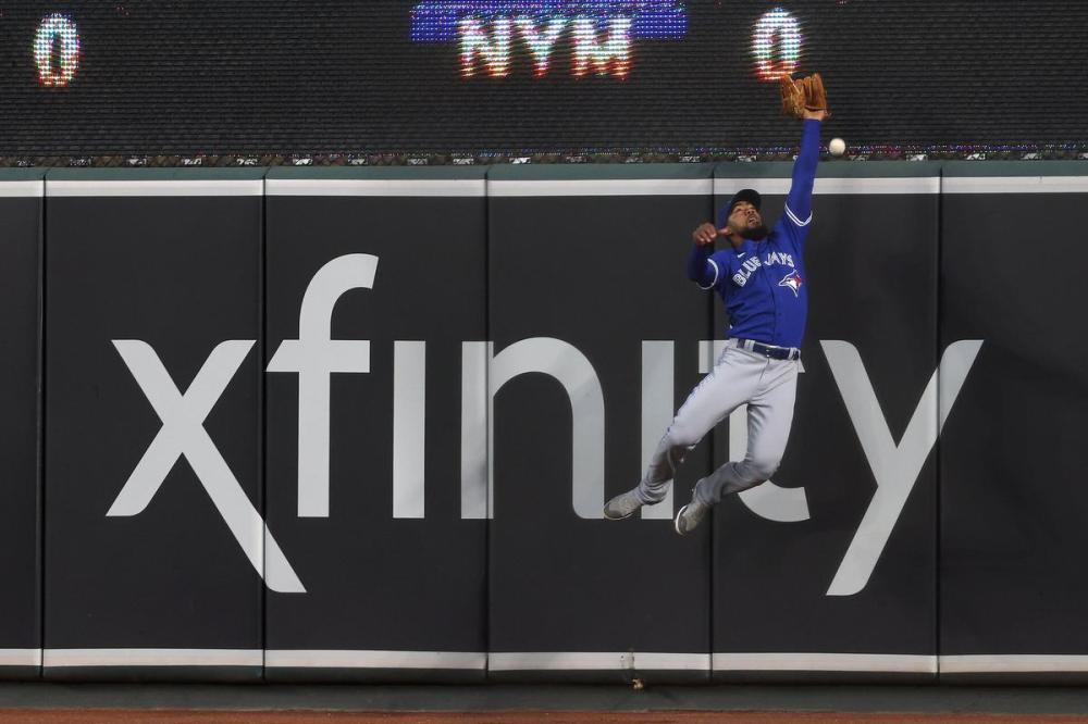 Rob Carr - GETTY IMAGES
Blue Jays right fielder Teoscar Hernandez can’t grab this ball hit by Baltimore’s Austin Hays, which ended up as a first-inning triple. Four of the first seven Orioles hitters had extra base hits off Toronto pitcher Robbie Ray.
