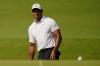 Sue Ogrocki - AP
Tiger Woods chips to the green on the first hole during a practice round for the PGA Championship golf tournament on Wednesday in Tulsa, Okla.