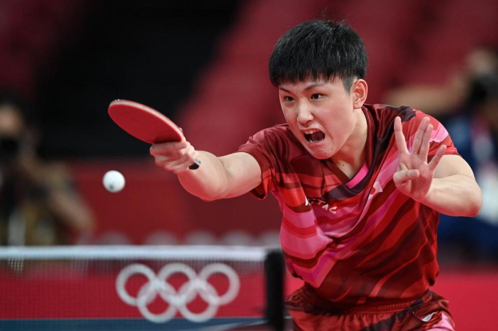 JUNG YEON-JE - AFP via GETTY IMAGES
Japan's Tomokazu Harimoto competes against Hong Kong’s Lam Siu-hang en route to a 4 games to 1 win in his first match of the Tokyo Games.