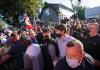 Nathan Denette - THE CANADIAN PRESS
Liberal leader Justin Trudeau is escorted by his RCMP security detail as protesters shout and through stones while leaving a campaign stop in London Ont. on Monday.