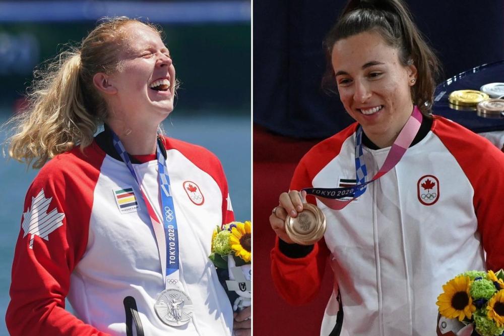 - (Nathan Denette/Greg Baker)
(L) Laurence Vincent-Lapointe, of Canada, reacts while wearing her silver medal after competing in the canoe sprint women's C-1 200m. (R) Bronze medallist Canada's Lauriane Genest poses with her medal after the women's track cycling keirin final.