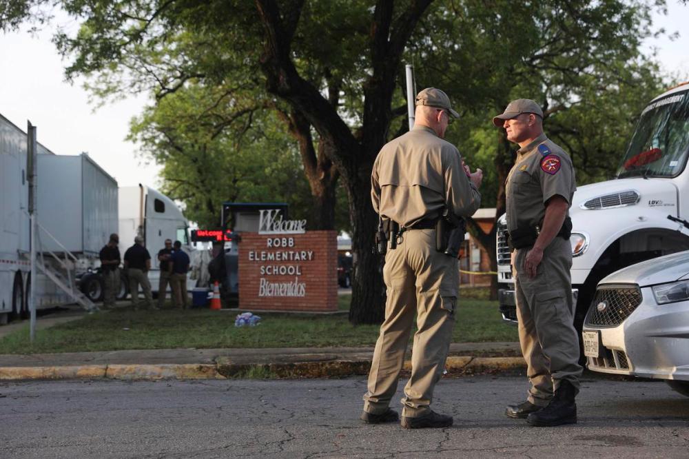 Jerry Lara - The San Antonio Express-News via AP
Officials continue investigations at Robb Elementary School in Uvalde, Texas, on Wednesday, May 25, 2022. On Tuesday, 18-year-old Salvador Ramos entered the school and killed multiple people including students.
