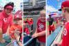 Braydon Holmyard - Family photos
Marshall McVey, 4, Abigail, 6, and Jacob Wilson, 15, (left to right) have their photos taken with Cincinnati Reds star Joey Votto.