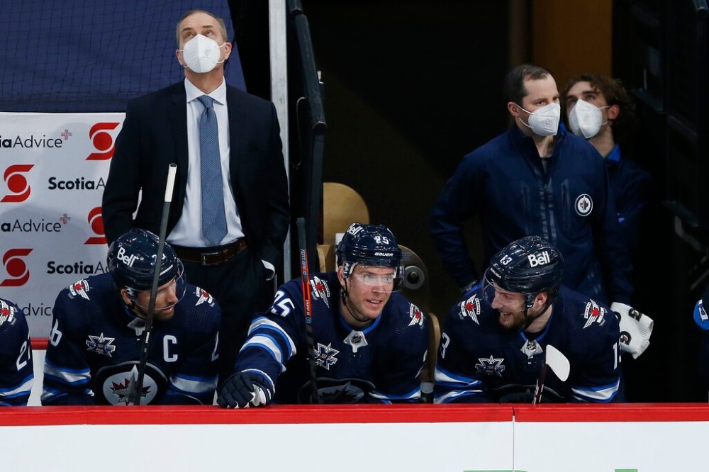 CP
Blake Wheeler, (left, with Paul Stastny, centre, and Pierre-Luc Dubois, right) didn't return for the final two periods. (John Woods / The Canadian Press)