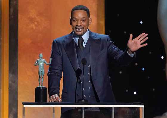 Will Smith accepts the award for outstanding performance by a male actor in a leading role for
