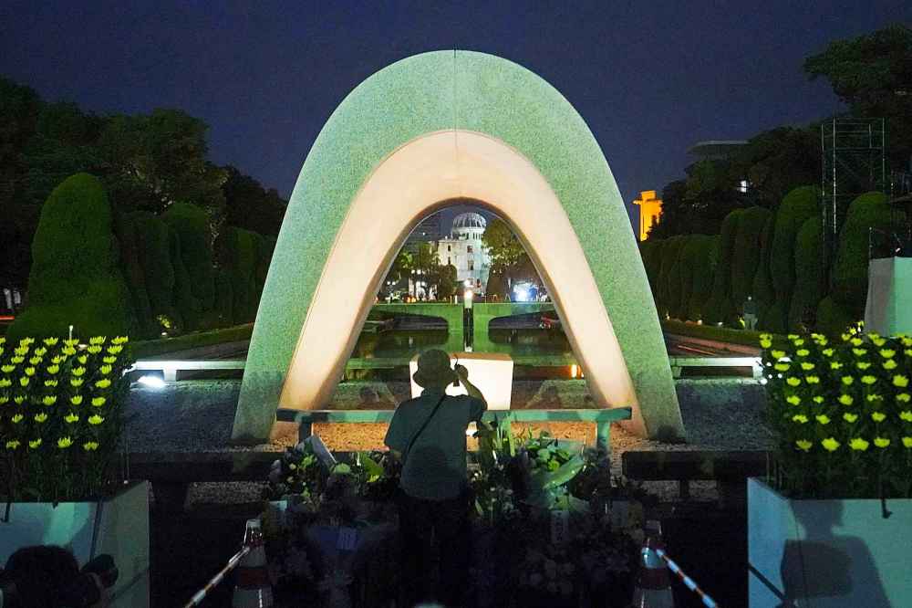 Eugene Hoshiko / The Associated Press
A visitor prays in front of the cenotaph for the atomic bombing victims before the start of a ceremony to mark the 75th anniversary of the U.S. bombing in Hiroshima.