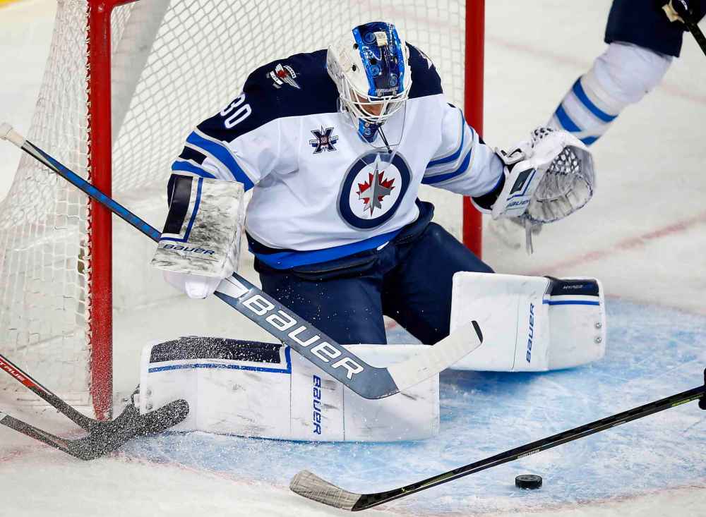 CP
Winnipeg Jets goalie Laurent Brossoit makes a save during the first period. (Todd Korol / The Canadian Press)