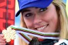 United States' Mikaela Shiffrin shows her gold medal for the women's combined race, at the alpine ski World Championships, in Cortina d'Ampezzo, Italy, Monday, Feb. 15, 2021. (AP Photo/Marco Tacca)