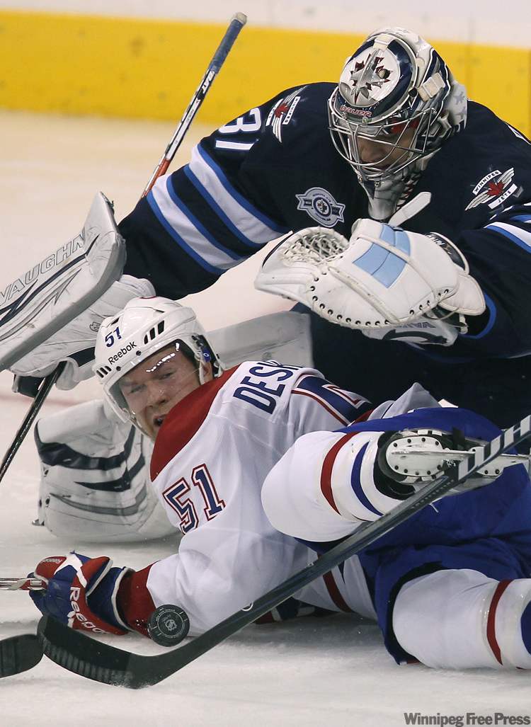 Canadien David Desharnais is stopped by goalie Ondrej Pavelec during second-period action. (Joe Bryksa / Winnipeg Free Press)