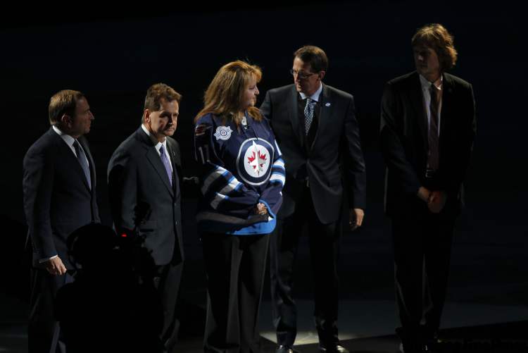 A special ceremony was held for Rick Rypien before the game, with Gary Bettman, Greg Heisinger, Shelly Rypien (mother), Mark Chipman and David Thomson taking part. (Boris Minkevich / Winnipeg Free Press)