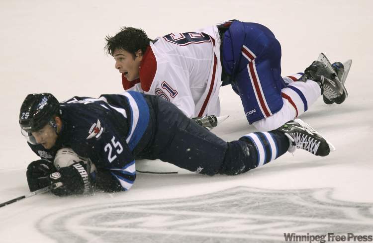Canadiens Raphel Diaz and Brett MacLean tie it up during third period. (Joe Bryksa / Winnipeg Free Press)