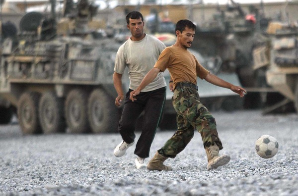 JOE BRYKSA/WINNIPEG FREE PRESS
WINNIPEG OUT-Panjwayi District, Afghanistan- A Afghanistan National Army member, right goes after the soccer ball from a Canadian soldier during a soccer game after dinner Wednesday evening at a forward operating camp in the Panjwayi District of Afghanistan- Aug 06, 2008