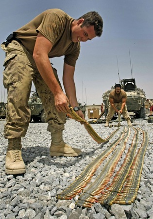 JOE BRYKSA/WINNIPEG FREE PRESS
WINNIPEG OUT-Panjwayi District, Afghanistan- Reserve Canadian soldier Bombadier Chris Conway, left, from Victoria BC takes stock of C6 machine gun rounds at a forward operating camp in the Panjwayi District of Afghanistan Wednesday morning- Aug 06, 2008