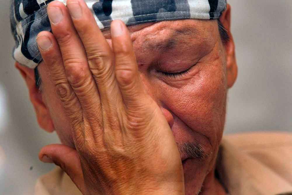 Faron Hall cries while describing trying to rescue drowning victim Chris Harper in 2009. Hall was able to save Harper's girlfriend, Tara Lynn Beardy, from the Red River.