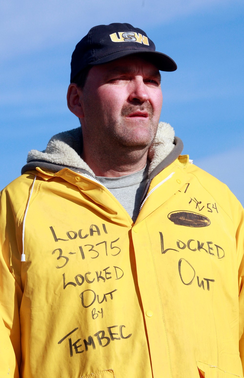 Norm Vezina, a 23 year mill worker, wears his sign on his jacket.