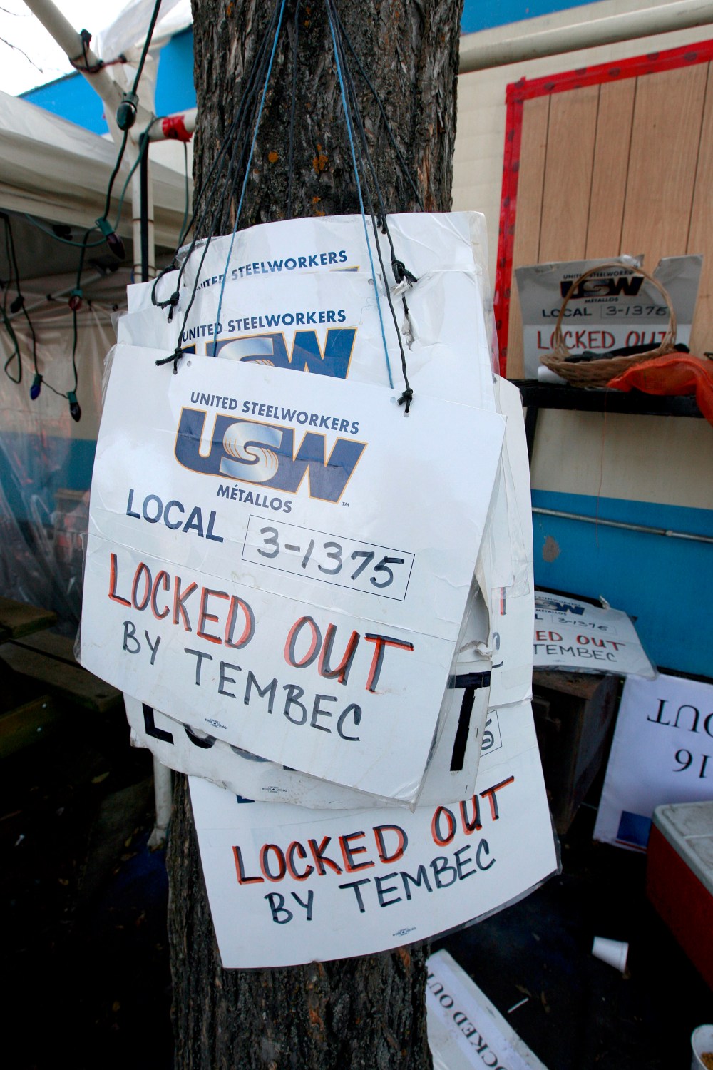 Picket signs at HQ outside the mill gate.