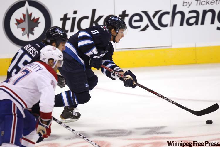 Jet Alexander Burmistrov charges down the ice during first-period action. (Joe Bryksa / Winnipeg Free Press)