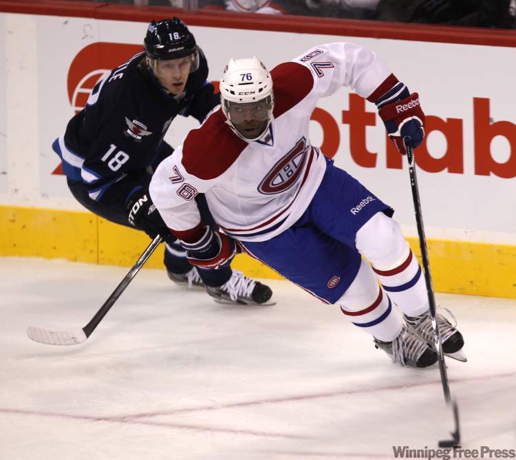 Canadien P.K. Subban pulls away from Bryan Little during first-period action. (Joe Bryksa / Winnipeg Free Press)