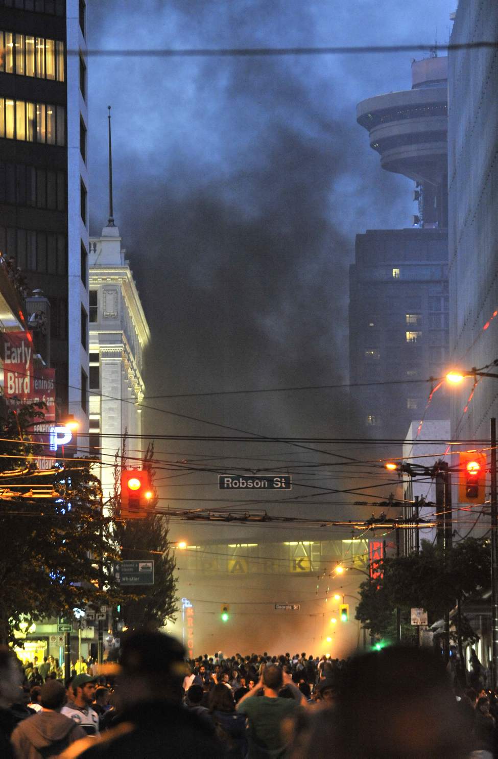 Smoke rises along Seymour street north of Georgia after the Canucks lost game seven of the 2011 NHL Stanley Cup final Wednesday June 15, 2011 in Vancouver, B.C. (Ian Lindsay / PNG staff photo)