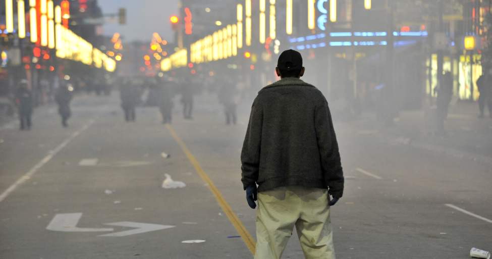 A lone man faces the police line on Granville Street amid the tear gas after the Canucks lost game seven of the 2011 NHL Stanley Cup final Wednesday June 15, 2011 in Vancouver, B.C. (Ian Lindsay / PNG staff photo)