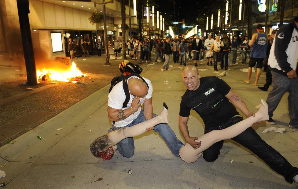 Fires burn around protesters on Granville street after the Vancouver Canucks lost to the Boston Bruins in game 7of the Stanley Cup in Rogers Arena in Vancouver, B.C. on June 15, 2011 (Mark van Manen/PNG)
