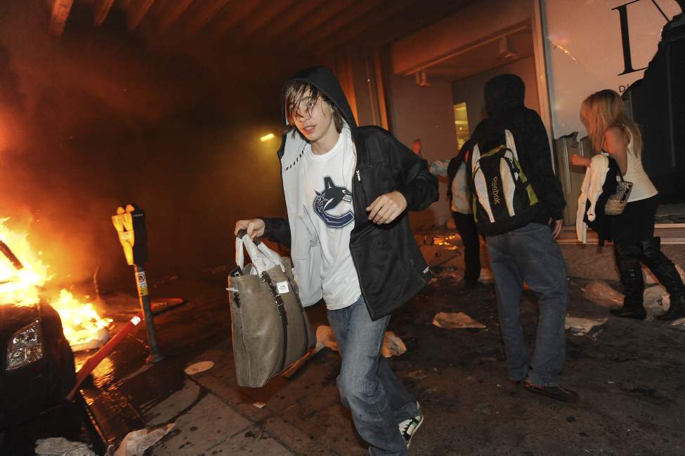 Rioters loot the Hudsons Bay store on Seymour Street as thousands run amok after game 7 of the Stanley Cup finals between the Canucks and the Boston Bruins in Vancouver, BC Wednesday, June 15, 2011. (Photo by Jason Payne/ PNG)