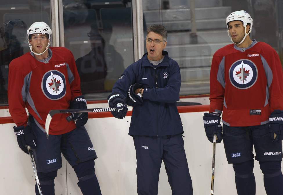 JOE BRYKSA / WINNIPEG FREE PRESS
Winnipeg Jets players, Shawn Weller, left, and Bryan Little listen as head coach Claude Noel gives instructions at practice Sunday afternoon.