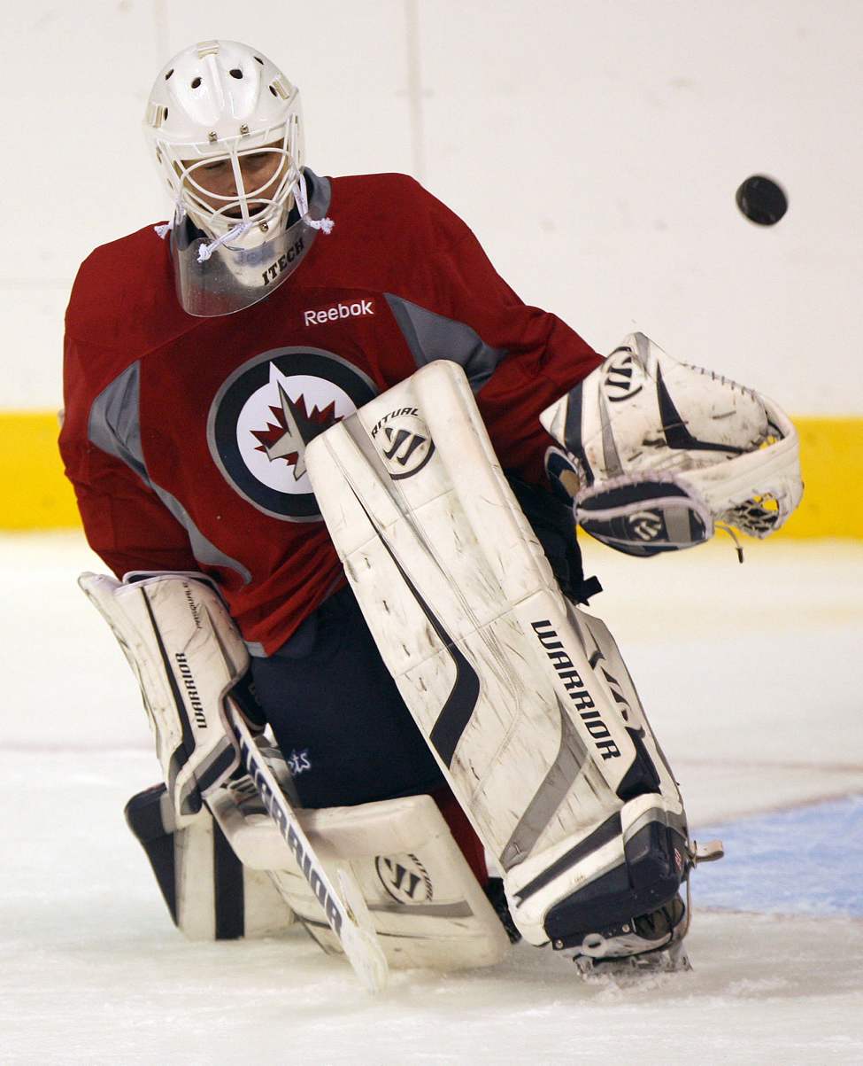 Winnipeg Jets goaltender Edward Pasquale gets peppered with pucks at afternoon training camp Monday at MTS Centre.The Jets take on Columbus Tuesday night in an exhibition game the MTS Centre- See Ed�s story � September 19, 2011   (JOE BRYKSA / WINNIPEG FREE PRESS)