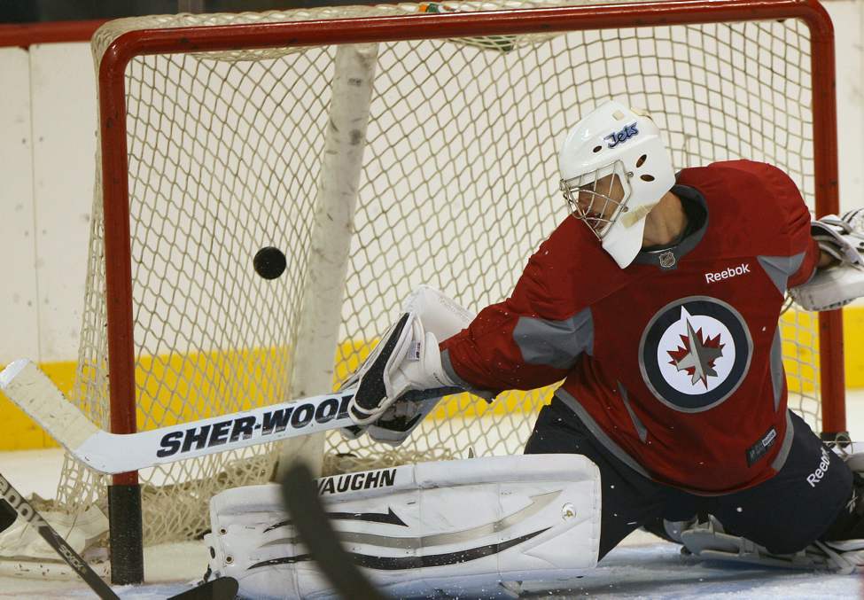 JOE BRYKSA / WINNIPEG FREE PRESS
Chris Carrozzi gets beat on a slapshot at the MTS Centre.