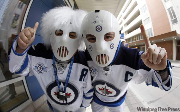 Edgar Purganan and Keith Lavallee outside the MTS Centre. (Trevor Hagan / Winnipeg Free Press)