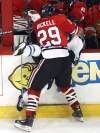 Winnipeg Jets Tobias Enstrom gets crushed by Chicago Blackhawks  Bryan Bickell during second- period action.  (Joe Bryksa / Winnipeg Free Press)