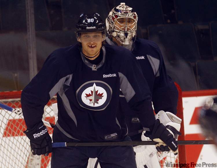 Nik Antropov sports a Halloween smile during a deflection drill at game-day practice Monday. (Ken Gigliotti / Winnipeg Free Press)