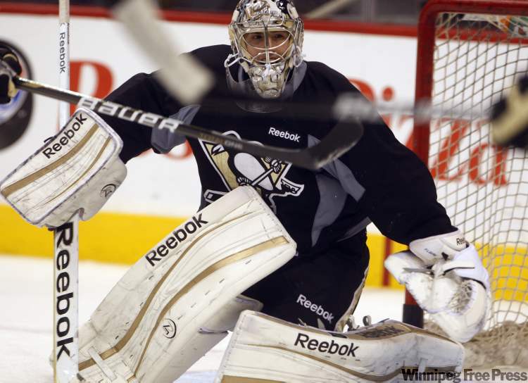 Pittsburgh Penguins goaltender Marc-Andre Fleury gets a workout during his team's practice at the MTS Centre. (Ken Gigliotti / Winnipeg Free Press)