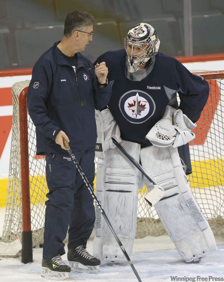 Joe Bryksa / Winnipeg Free Press
Winnipeg Jets head coach Claude Noel has a chat with Jets starting goaltender Ondrej Pavelec at the morning skate at the MTS Centre in Winnipeg Wednesday afternoon. The Winnipeg Jets are preparing for a home game against the Phoenix Coyotes on Thursday night.