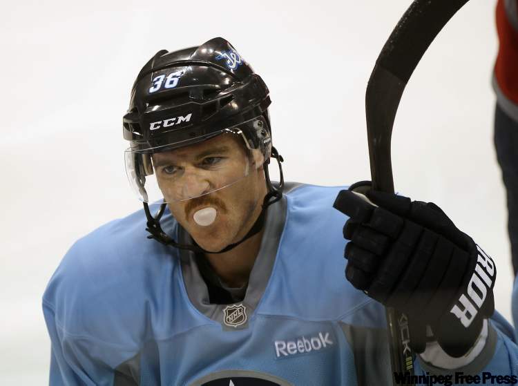 Joe Bryksa / Winnipeg Free Press
Winnipeg Jets defenceman Mark Flood blows a bubble during morning practice at the MTS Center in Winnipeg Wednesday afternoon.