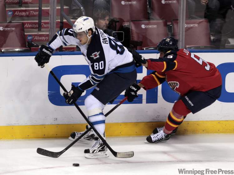 Alan Diaz / The Associated Press
Winnipeg Jets' Nik Antropov (80) is checked by Florida Panthers' Ed Jovanovski (55) in the first period of an NHL hockey game in Sunrise, Fla., Monday.