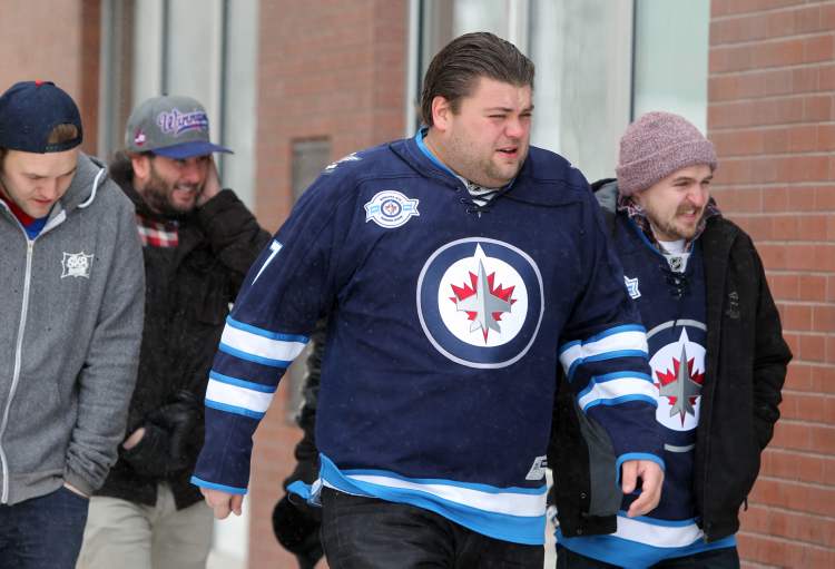 RUTH BONNEVILLE / WINNIPEG FREE PRESS
Winnipeg Jets fans brave the weather on one of Winnipeg's coldest days wearing their Jets jerseys as they make their way down Donald Street Saturday to the first Winnipeg Jets, NHL game of the season.