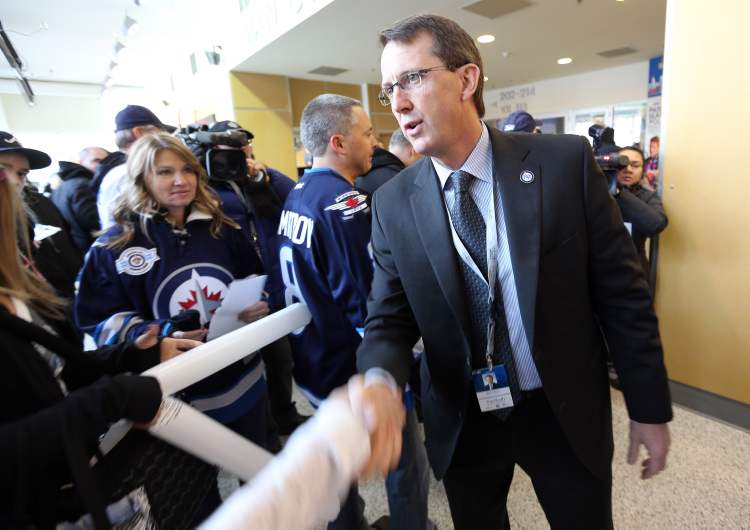 TREVOR HAGAN / WINNIPEG FREE PRESS
True North owner Mark Chipman greets fans in the MTS Centre foyer before the start of the Winnipeg Jets game versus the Ottawa Senators on Saturday.