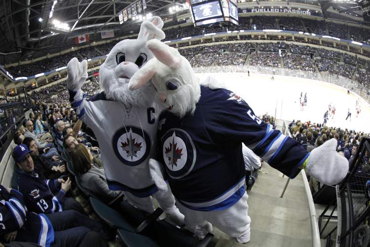 TREVOR HAGAN / WINNIPEG FREE PRESS
Cloudy Cuddles McRabbit and Theodore L. Rabbit cheer as the Jets face the Carolina Hurricanes on Easter weekend.