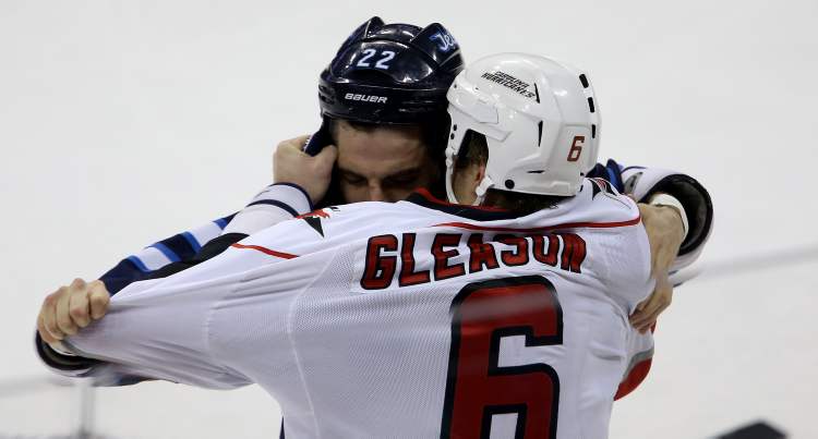TREVOR HAGAN / WINNIPEG FREE PRESS
Winnipeg Jets' Chris Thorburn drops the gloves with Carolina Hurricanes' Tim Gleason during the first period.