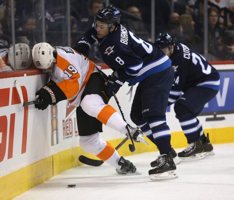 TREVOR HAGAN / WINNIPEG FREE PRESS
Winnipeg Jets' Alexander Burmistrov (8) shoves Philadelphia Flyers' Scott Hartnell (19) into the boards during the first period of Saturday afternoon's game.