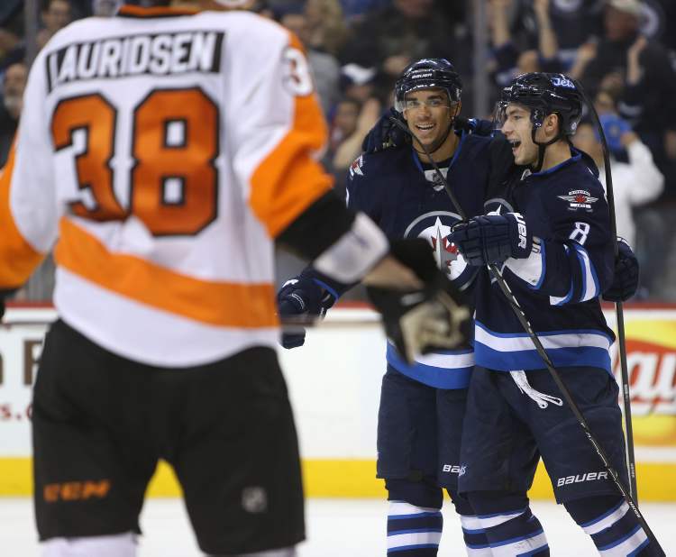 TREVOR HAGAN / WINNIPEG FREE PRESS
Winnipeg Jets' Evander Kane (9) and Alexander Burmistrov (8) celebrate after Kane scored during the second period of Saturday afternoon's game against the Philadelphia Flyers.