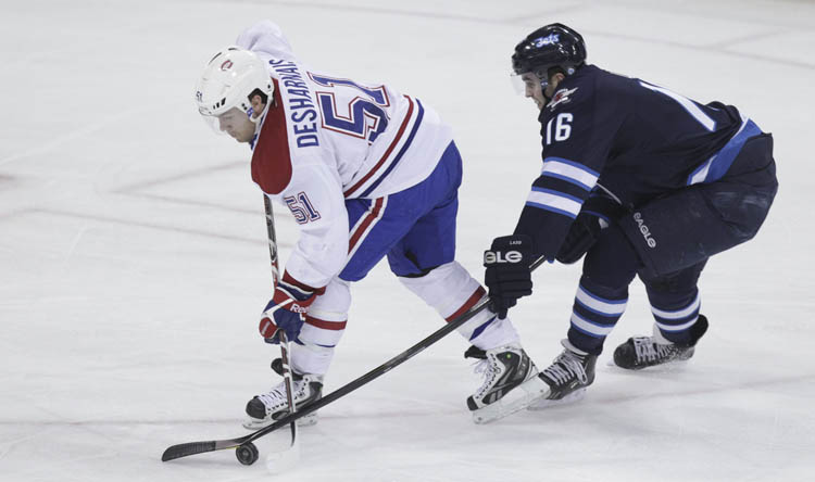 MIKE DEAL / WINNIPEG FREE PRESS
Winnipeg Jets' Andrew Ladd tries to stick check Montreal Canadiens' David Desharnais (51) but was called for a penalty Thursday night.
