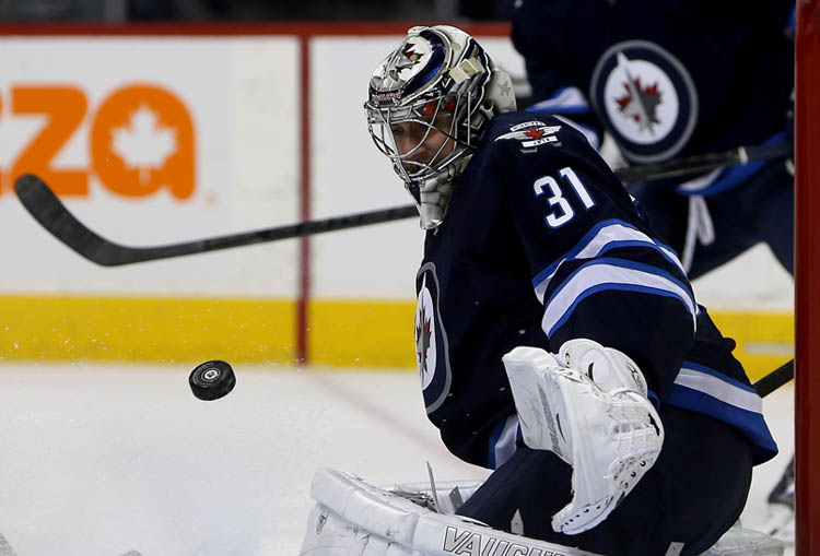 TREVOR HAGAN/WINNIPEG FREE PRESS
Winnipeg Jets' Ondrej Pavelec stops a Montreal Canadiens' shot during the first period.