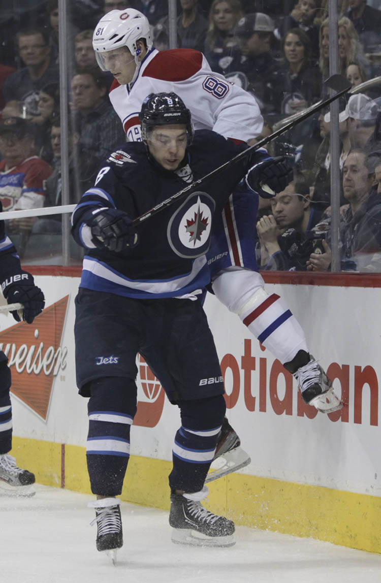 MIKE DEAL / WINNIPEG FREE PRESS
Winnipeg Jets' Alexander Burmistrov (8) checks Montreal Canadiens' Lars Eller (81) behind the Montreal Canadiens' net in the second period.