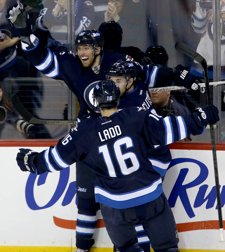 TREVOR HAGAN / WINNIPEG FREE PRESS
Winnipeg Jets' Blake Wheeler (26), Grant Clitsome (24) and Andrew Ladd (16) celebrate after Wheeler scored to retake the lead against the Montreal Canadiens' in the second period.