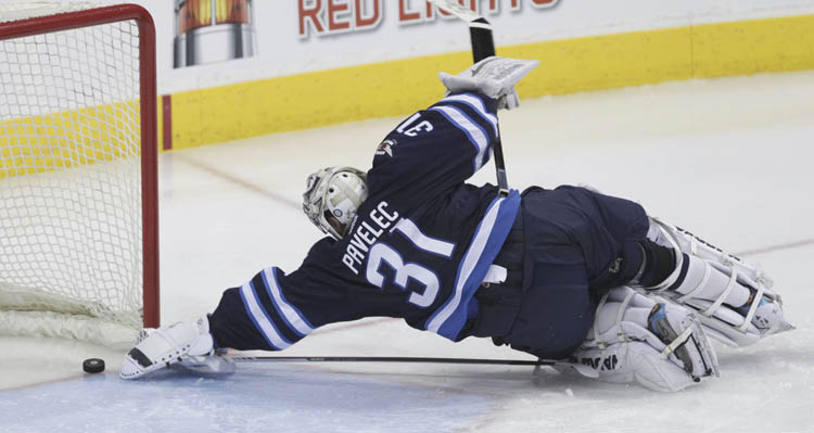 MIKE DEAL / WINNIPEG FREE PRESS
Winnipeg Jets' goaltender Ondrej Pavelec can't reach the puck to stop Tomas Plekanec's game-tying goal to make it 2-2 in the third period.