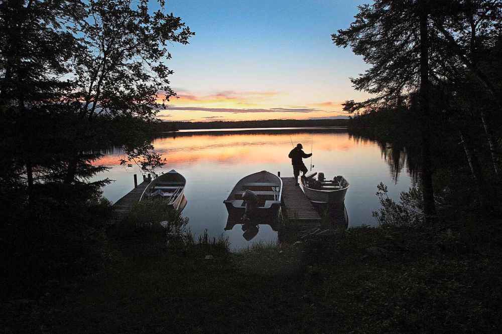 Matt McCorquodale heads out before sunrise for a morning of fishing on Marion Lake in Whiteshell Provincial Park in June 2013.